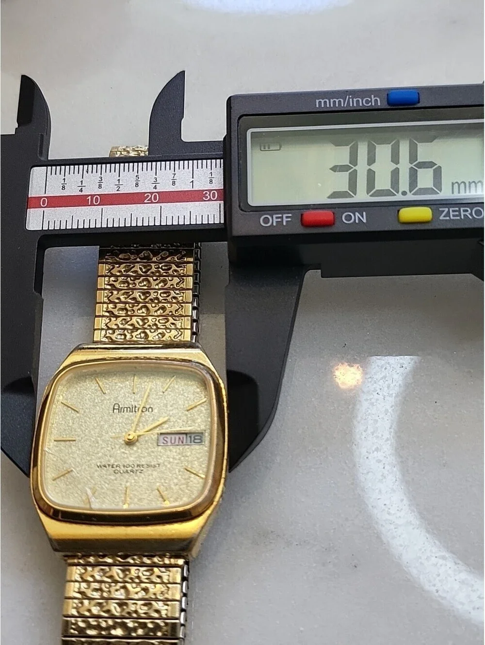 Armitron Men’s Watch Dust Gold Tone TankDate DayDial Nugget Band New Batt. 31mm
